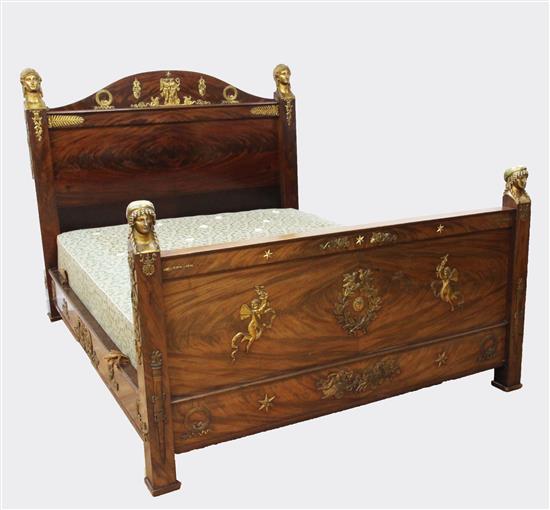 An Edwards & Roberts French Empire style ormolu mounted flame mahogany bedstead, W.5ft 4in. H.4ft 6in. L.8ft